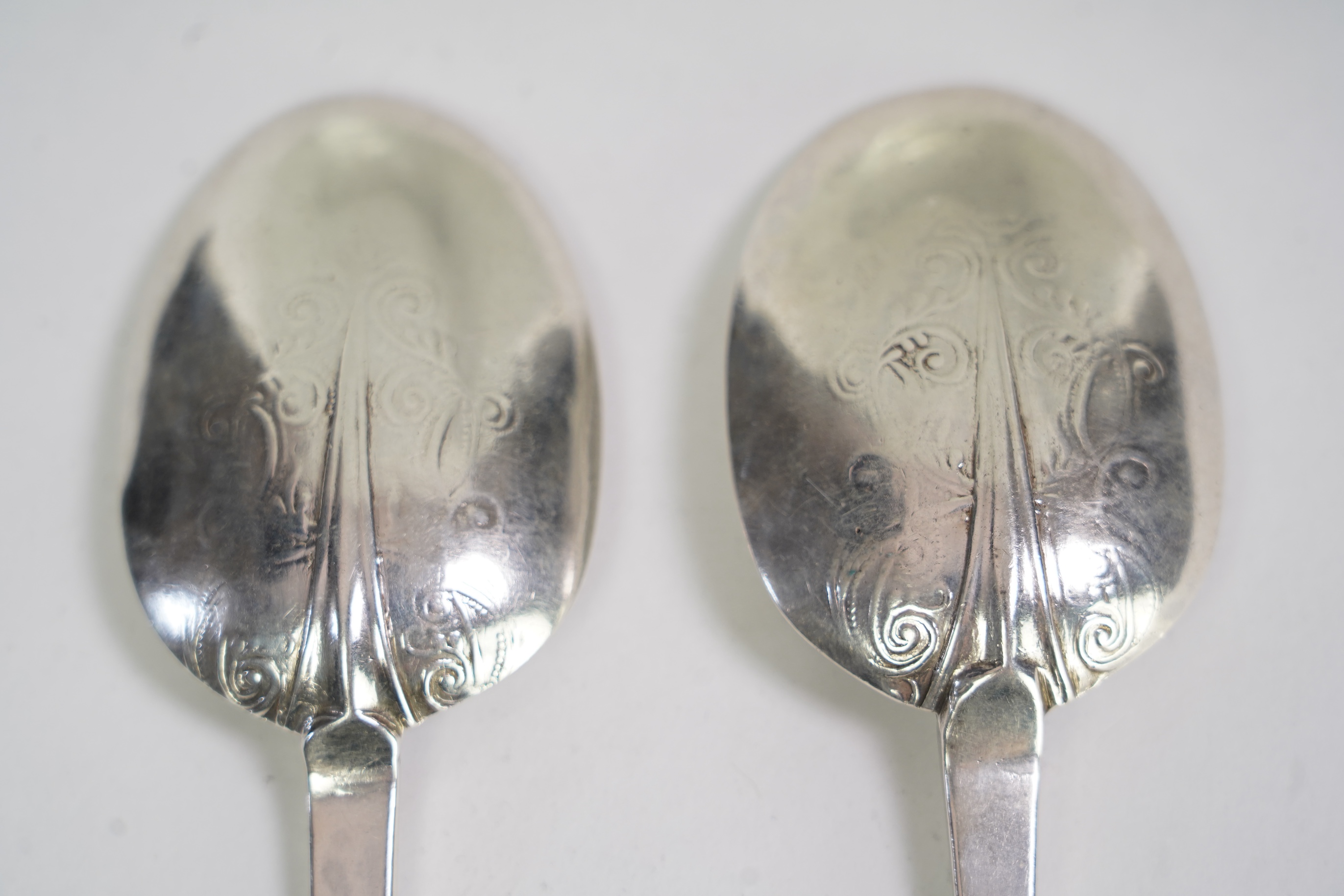 A pair of Charles II silver lace back trefid spoons, maker PL (Jackson's ref. p.137)